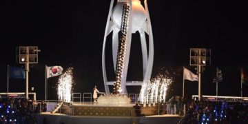 Olympics-Korean figure skater Kim Yuna lights Olympic cauldron