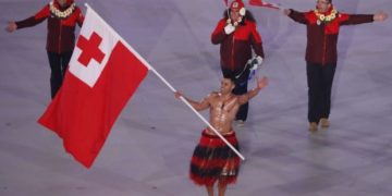 Bare-chested Tongan flag-bearer wins Korean hearts