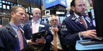 Wall Street rallies as Powell hints at slowing rate hikes