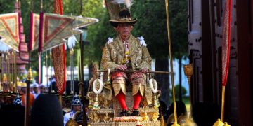 Newly crowned Thai king carried through Bangkok in royal procession