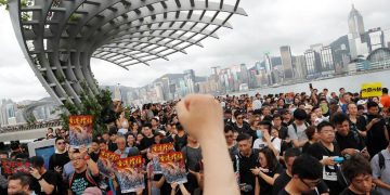 Hong Kong protesters march again, hope to explain grievances to Chinese visitors