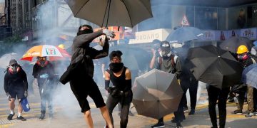 Hong Kong enters recession as protests again erupt in flames