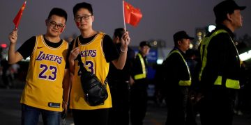 China basketball fans wave national flags at arena in row over HK tweet