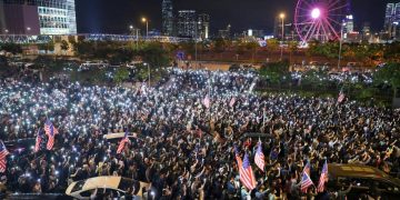 China warns U.S. over Hong Kong law as thousands stage ‘Thanksgiving’ rally