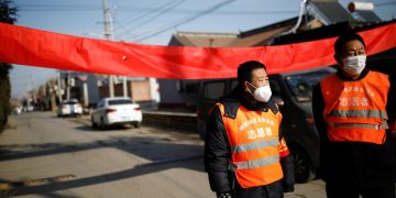 U.S., Japan pull nationals from China, big virus economic hit forecast