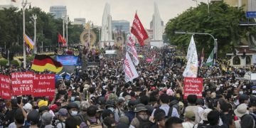 Thai democracy protesters march despite police, rival groups