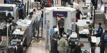 COVID-19 variant disrupts holiday travel but not shopping