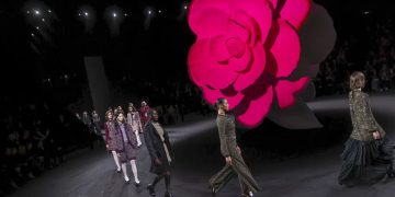 Chanel’s camellias, empty chairs close Paris Fashion Week