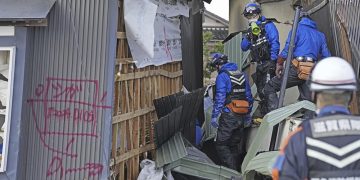 Survivors are found in homes smashed by Japan quake that killed 94 people. Dozens are still missing