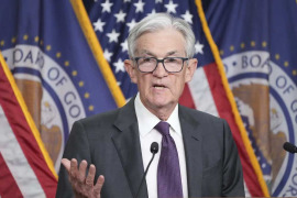 The Federal Reserve sees tariffs raising inflation this year and keeps key rate unchanged