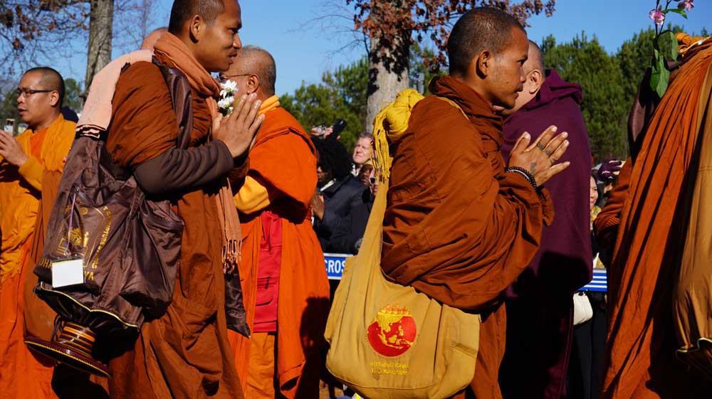 Walk for Peace monks arriving at Wat Lao Buddha Khanti. Photo: Georgia Asian Times