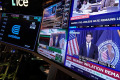 US stocks slip after the Fed hikes interest rates and hints more increases may be on the way
