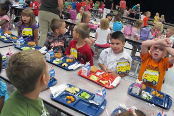 First graders at Wea Ridge Elementary in Lafayette eat lunch on Thursday, Aug. 16, 2012. Schools in Indiana and across the country are changing what they're serving to meet new federal school lunch guidelines.